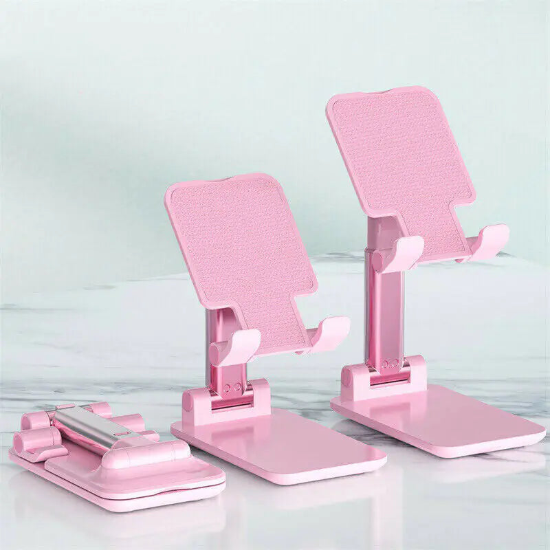 Universal phone and tablet holder with adjustable height and tilt.