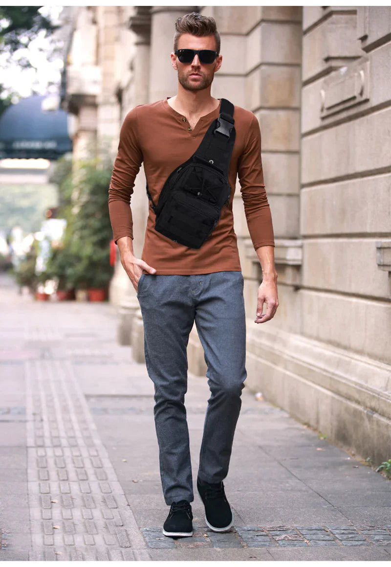 Adjustable MOLLE tactical sling shoulder bag for men with multiple pockets.